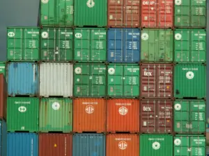Stacked colored shipping containers at a container depot